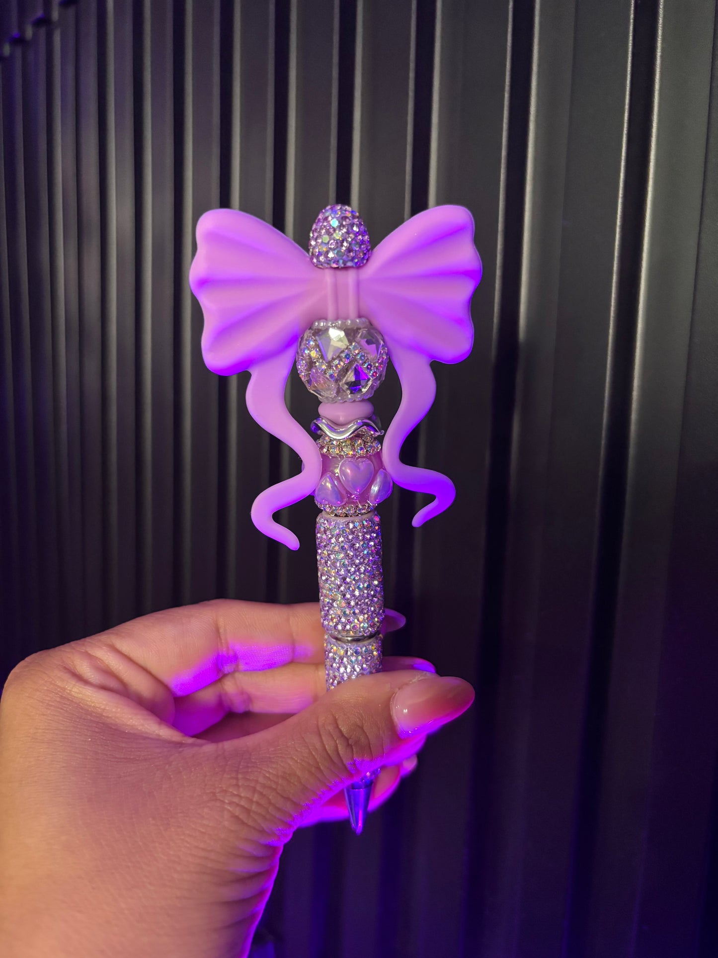 Purple bow on full bling pen